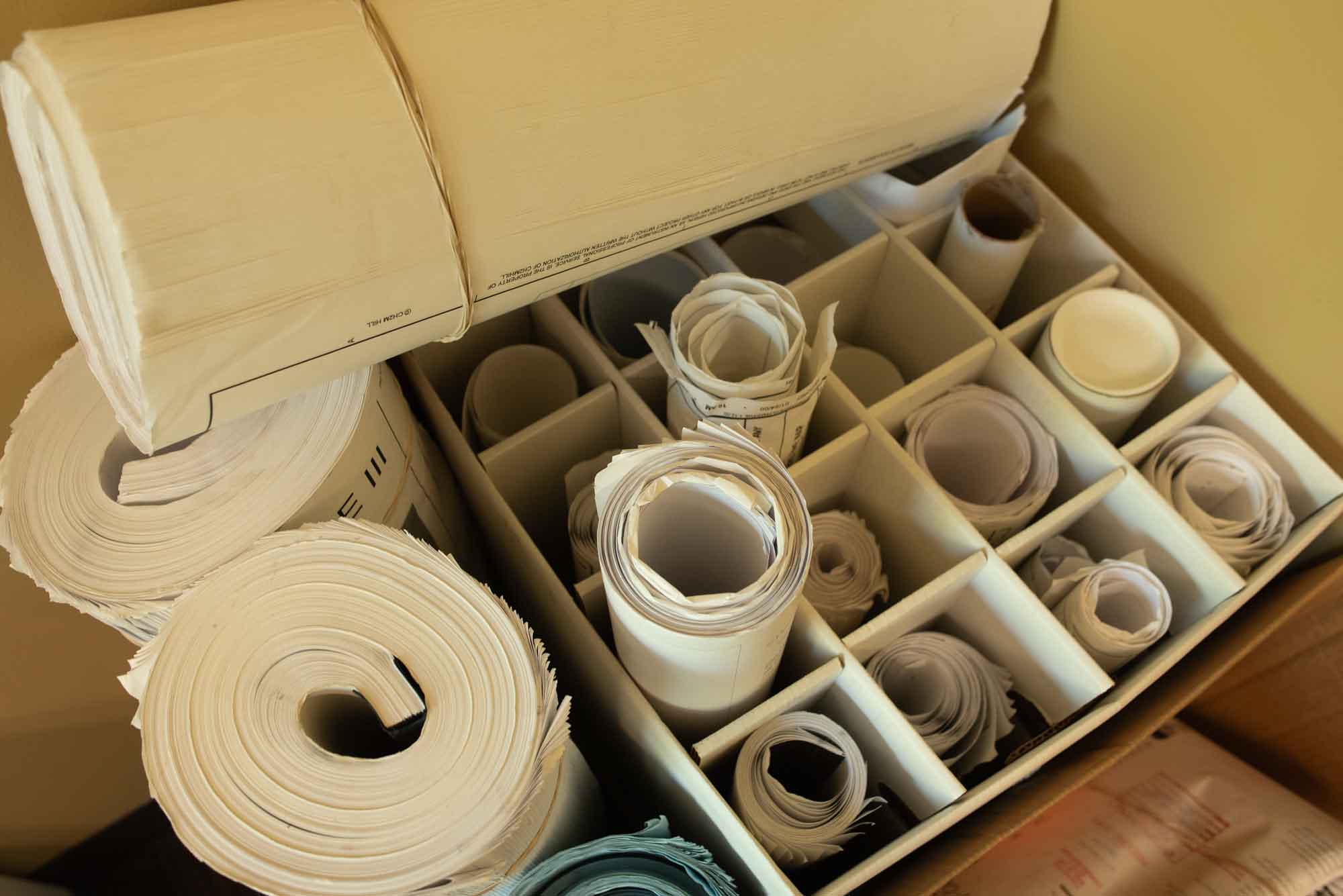 A box of rolled up plans.