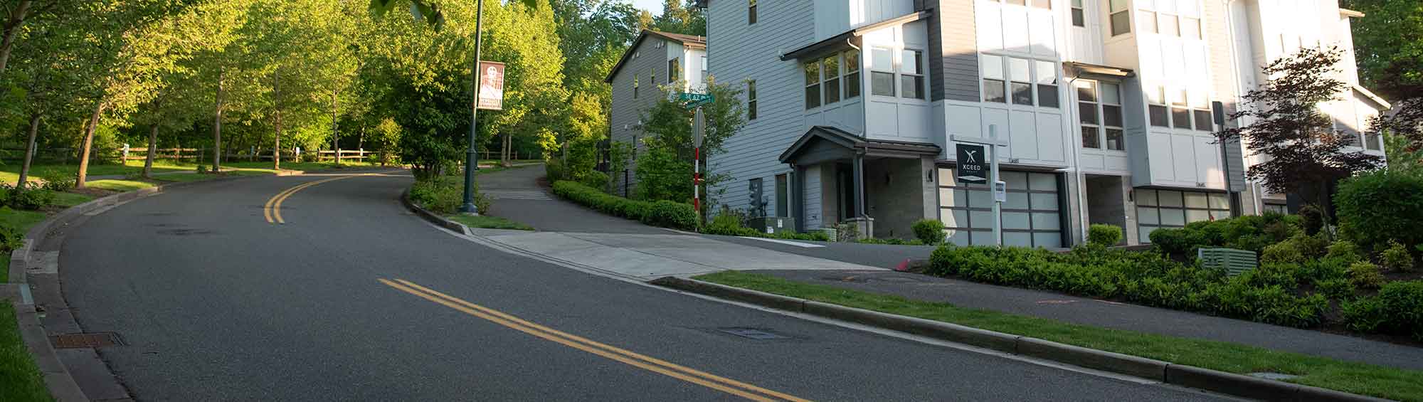 A road curves up a hill in Newcastle Commons.